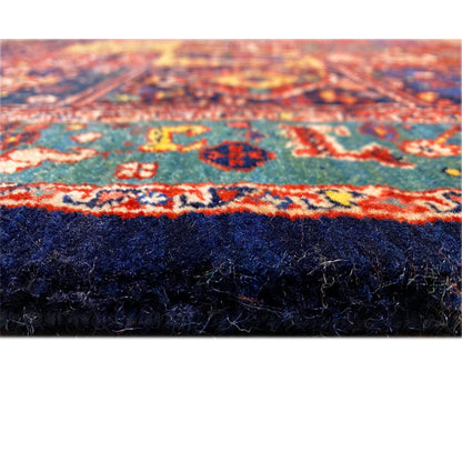Close-up of the Qashqai carpet edge: multicolored surface with a dark pile underside