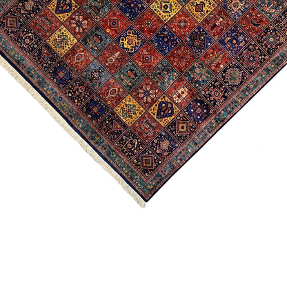 Qashqai rug corner close-up, colorful ornamental pattern and light-colored fringes