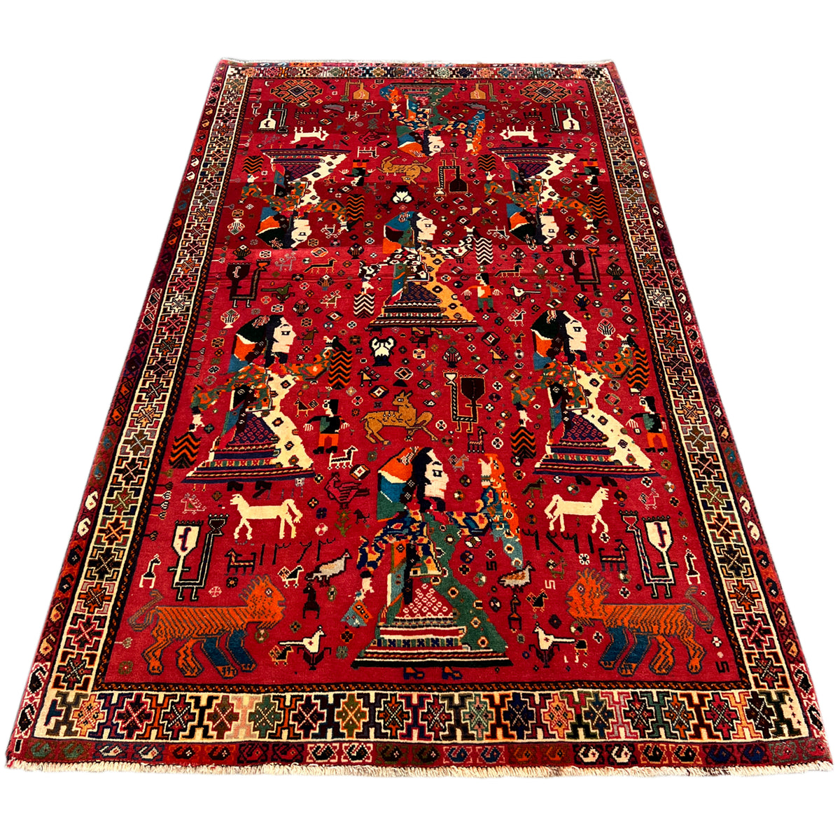 Red Qashqai rug with central figures, border, and fine ornaments