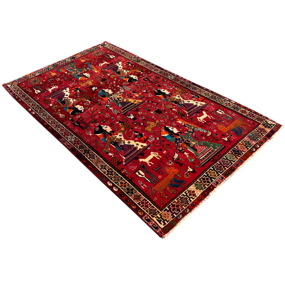Red Qashqai rug with a woven central design, intricate border, and corners
