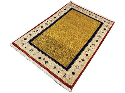 Rug with a yellow central field, blue border, and patterned bands in cream and red