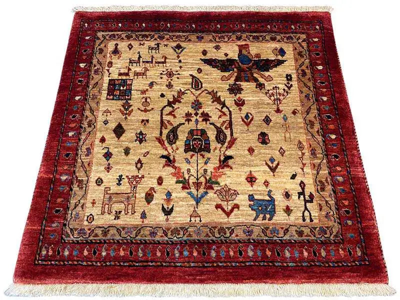 Square rug with a red inner border, beige background, and intricate ornamental pattern.
