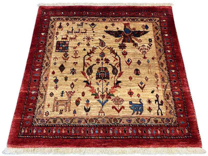 Square rug with a red inner border, beige background, and intricate ornamental pattern.