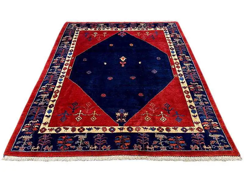 Rectangular rug with a blue center, red border, and decorative edging