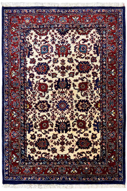 Rug with a large central medallion, beige field, border in red and dark blue