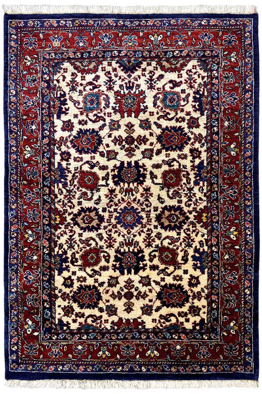 Rug with a large central medallion, beige field, border in red and dark blue