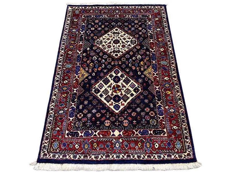 Carpet with dark blue, red border, ornamental medallions, and fringe