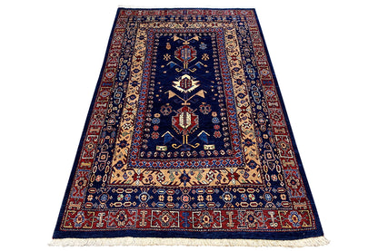 Carpet 183x117 cm with a dark blue base, beige side stripes, and fringes