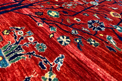 Close-up: red carpet with colorful floral and ornamental patterns