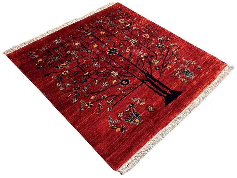 Red Oriental rug with tree and animal motifs, square, fringes