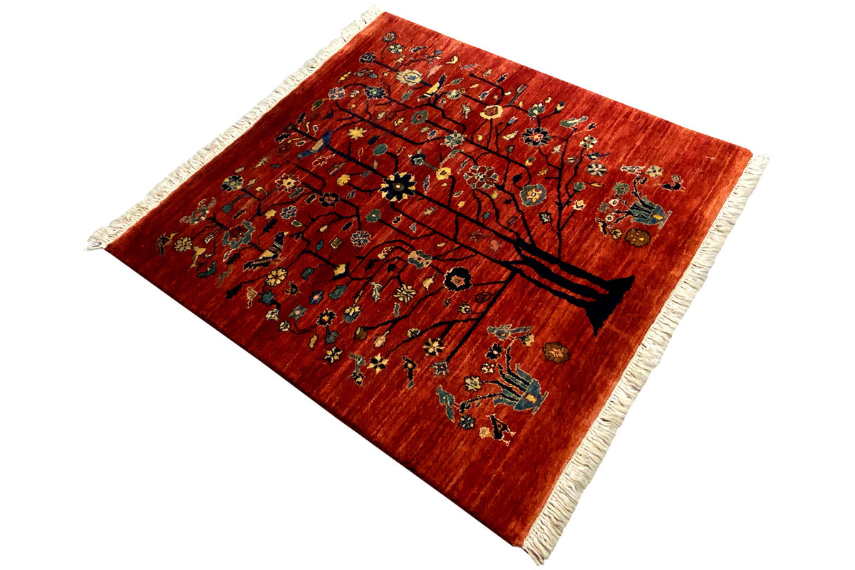 Qashqai rug with a tree motif in red, spread out diagonally