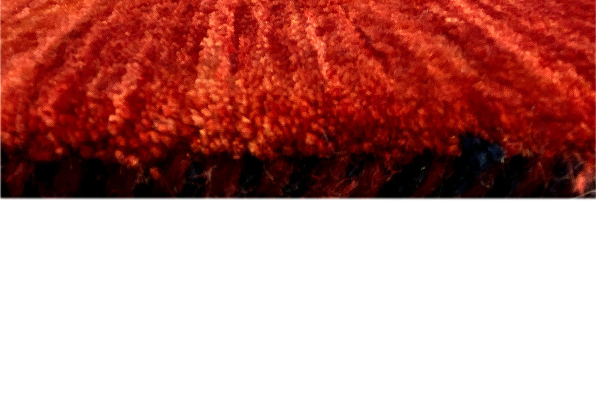 Qashqai carpet fringes along the red edge