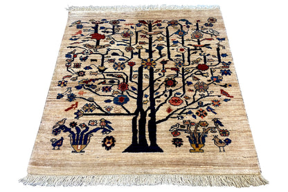 Rectangular Oriental rug with a tree motif, beige background and colorful ornaments