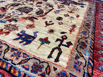 Close-up of a rug with a beige background and colorful ornamental figures in a floral pattern