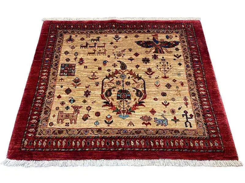Red Oriental rug with a beige central medallion and elaborate ornaments