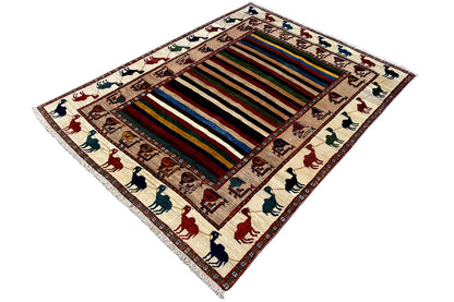 Oriental rug at an angle, colorful striped pattern with animal motifs along the edge