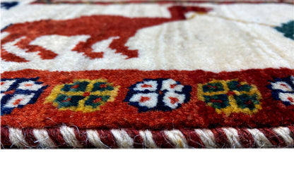 Close-up: carpet edge with fringe and a colorful striped pattern