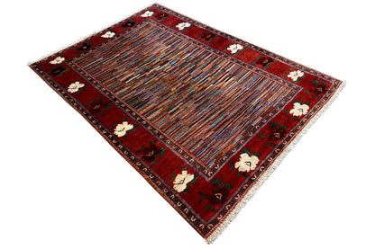 Carpet in diamond view: red field with a striped pattern and floral border