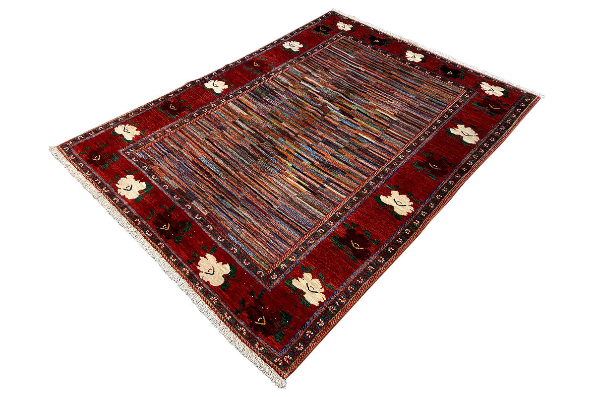 Rug from the corner: red Oriental design with fine lines and floral accents