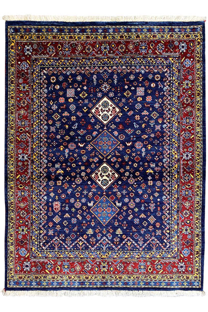 Rectangular blue Oriental rug with a red border and three medallion motifs