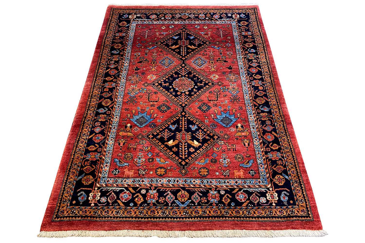 Reddish-brown oriental rug with a central diamond medallion and blue-bordered decorative elements