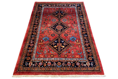 Reddish-brown oriental rug with a central diamond medallion and blue-bordered decorative elements