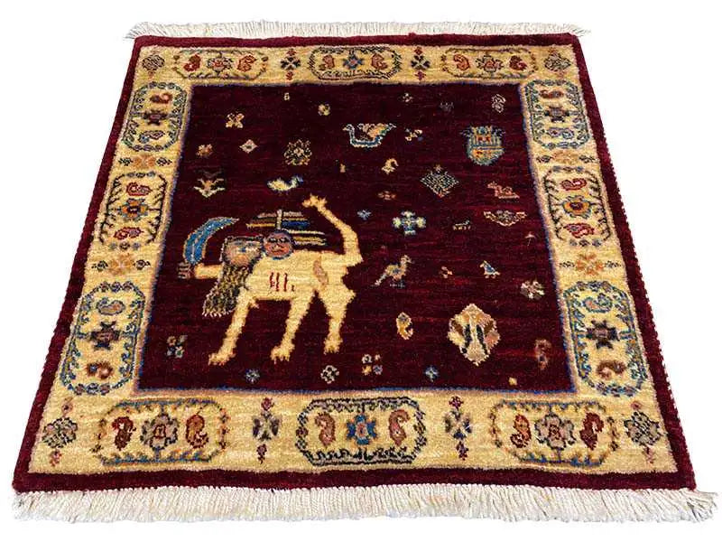 Square rug with a red background, a central animal motif, and a decorative border