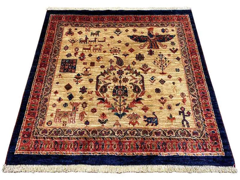 Qashqai exclusive rug with beige field, red border, and blue central ornament