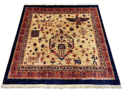 Qashqai exclusive rug with beige field, red border, and blue central ornament