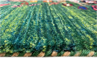 Close-up of a green carpet surface with dense pile fibers and color fringes