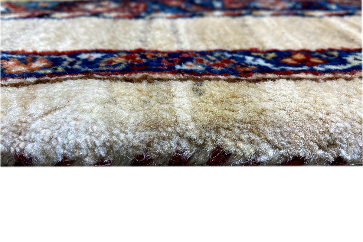 Carpet pile and fringe base with multicolored border, close-up