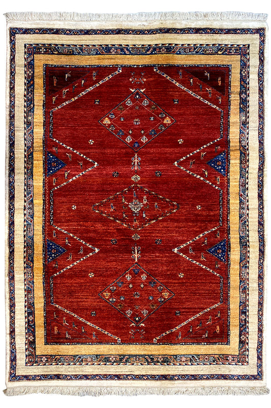 Oriental rug with a red geometric pattern, blue borders and fringes, 193×143 cm