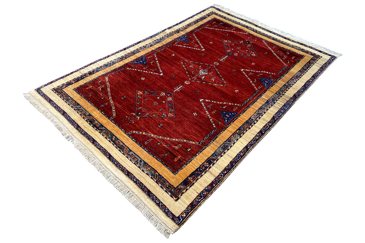 Rug 200x135 cm, red base with diamond and ornamental patterns, blue-and-white border, tassels