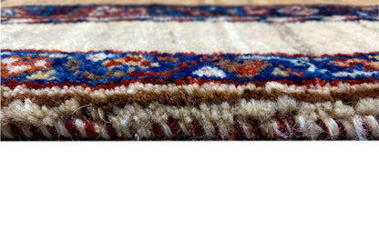 Rug edge with fringe, red field, and blue-and-white border