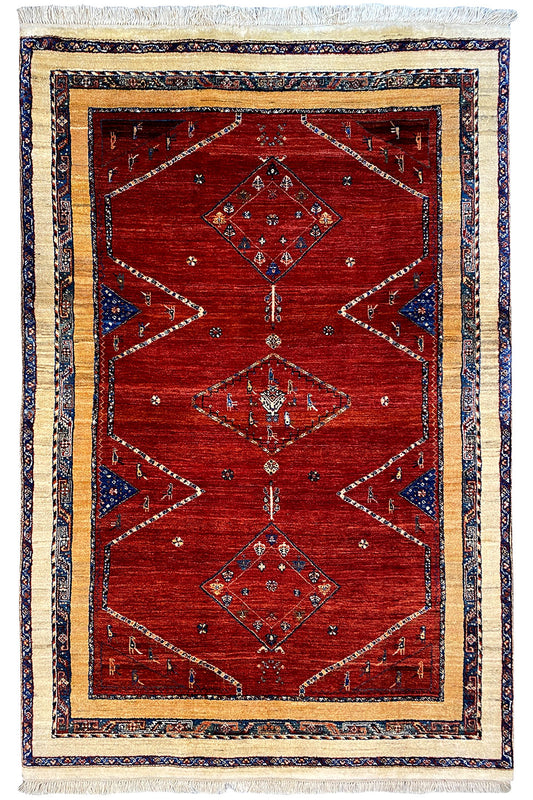 Rug 200x135 cm with a red background, blue border, geometric patterns, and tassels