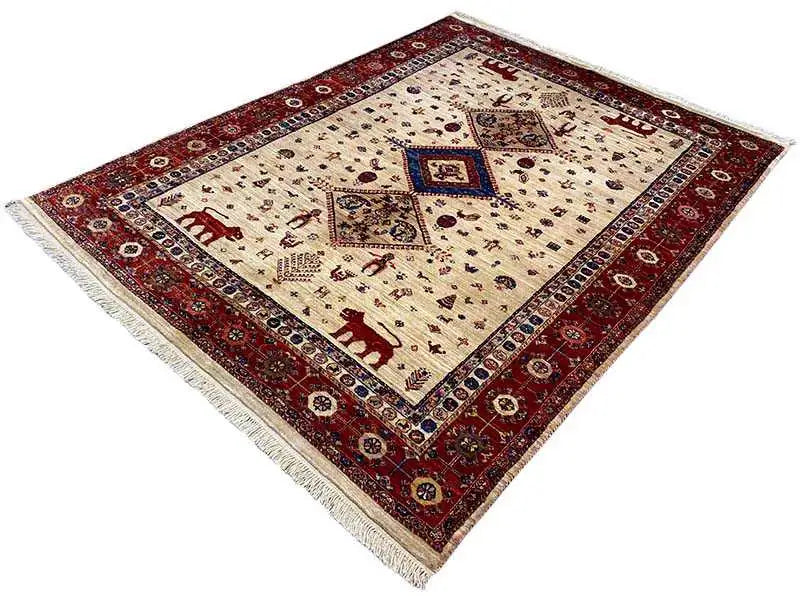 Carpet corner with a red border, cream-colored field, blue central medallion, and fringe