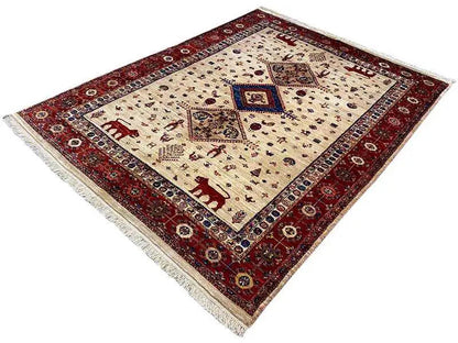 Carpet corner with a red border, cream-colored field, blue central medallion, and fringe
