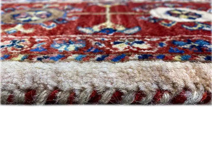 Carpet fringe along the edge, multicolored border look, cream-colored fiber base