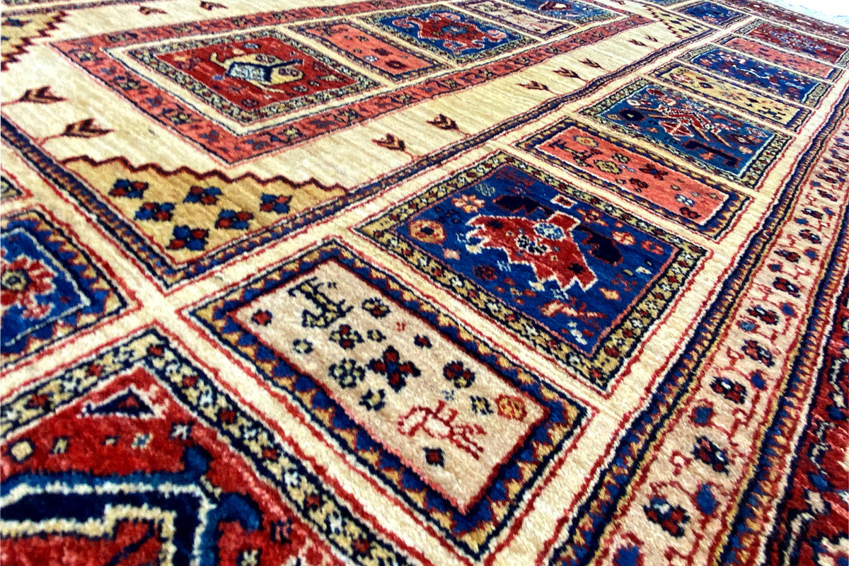 Detailed view: geometric ornaments in blue, red, and cream on a beige background