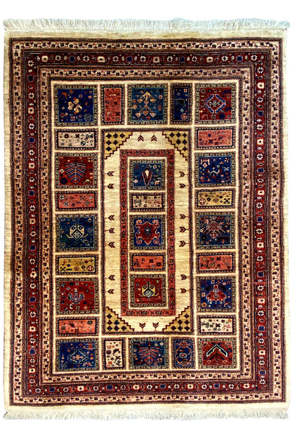Classic rug with a central medallion and colorful border, fringes on all sides
