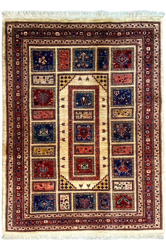 Classic rug with a central medallion and colorful border, fringes on all sides