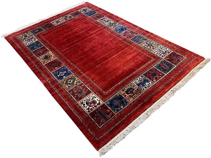 Striped red carpet with a blue border and white fringes
