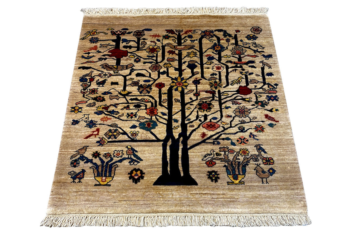 Carpet with a central tree in black, beige background, and colorful ornaments