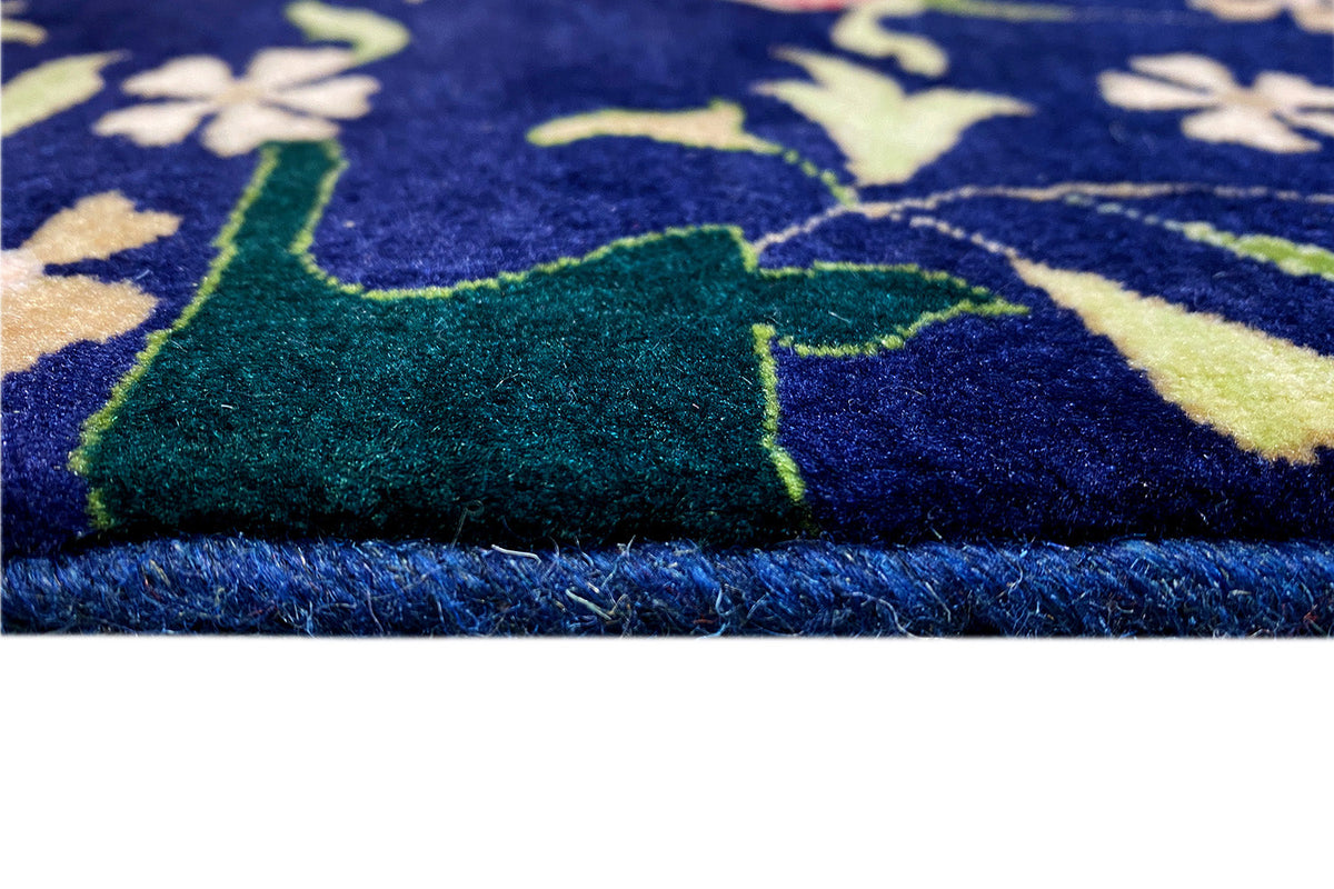 Close-up of carpet pile and edge fringe, blue pattern