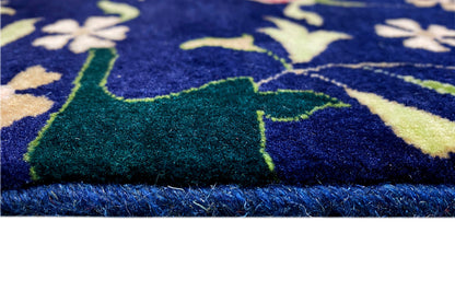 Close-up of carpet pile and edge fringe, blue pattern