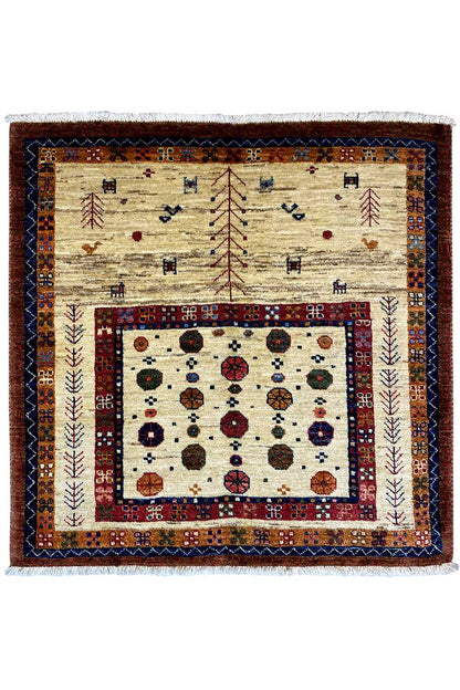 Beige Oriental rug with red and blue border trim and a central pattern