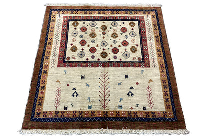 Rectangular rug with a central medallion and border in blue, red, and cream