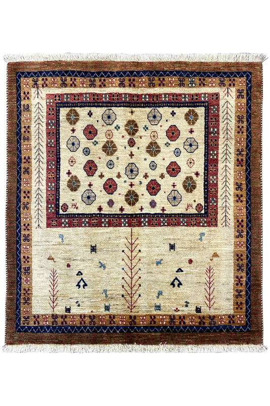 Rectangular rug with a cream-colored central medallion and blue-red ornamentation