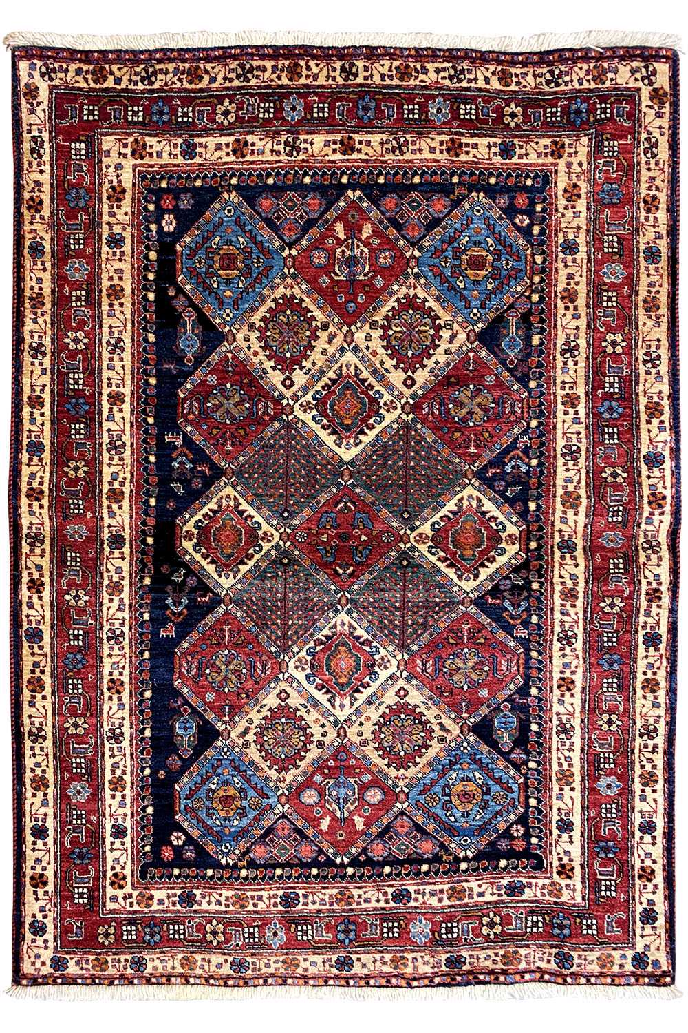 Rectangular rug with a light background and symmetrical diamond pattern in red and blue