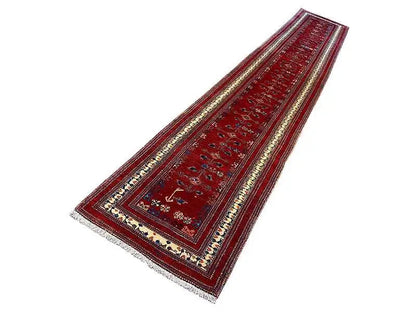 Red oriental runner with decorative borders and a central patterned band